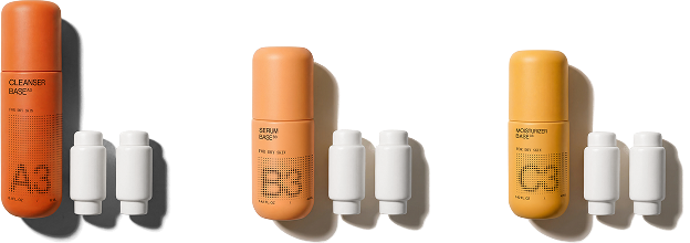 Cleanser Base bottle with two white concentrate pods on a black background.
